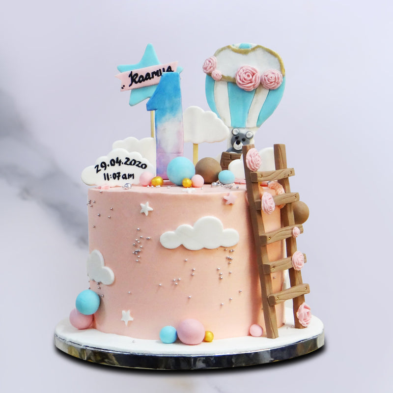 Front view of Hot air balloon cake with clouds and stars topper. This Hot air balloon cake is best as 1st birthday cake for kids