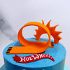 Zoomed front view of Hotwheels cake with small fondant twisted racing track and a calssic hotwheels logo. This is a perfect Birthday cake for boys  