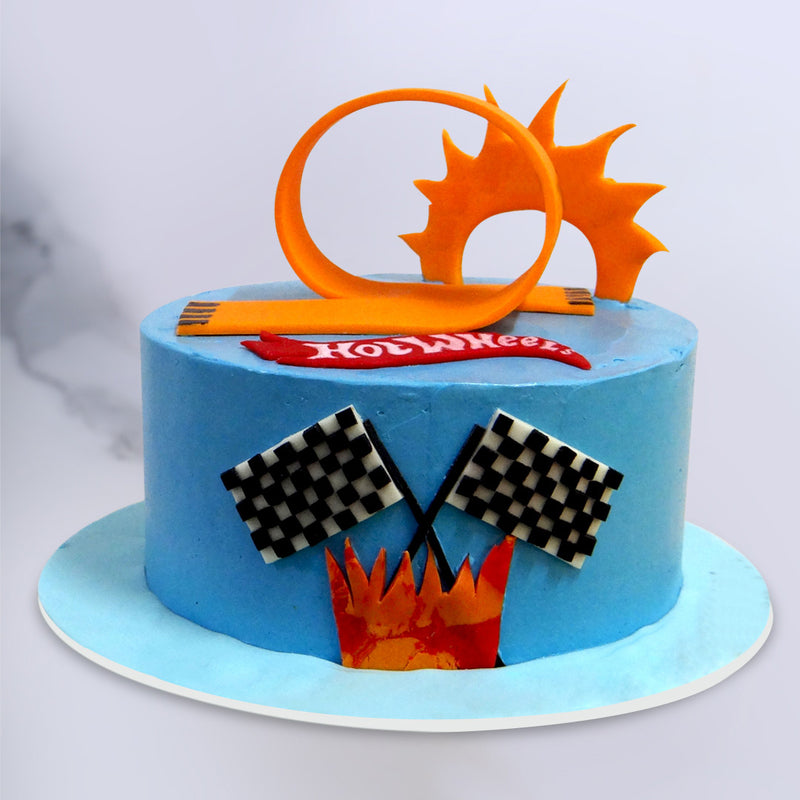 Hotwheels cake is complete with checkered flags and the twisting racetrack. This car design cake is absolutely an state of the art design and a perfect birthday cake for boys 