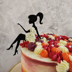 The colour gradient used on the base of the lady dress cake is similar to that of a planet with hues of red, orange and brown and embedded with flowers all around.