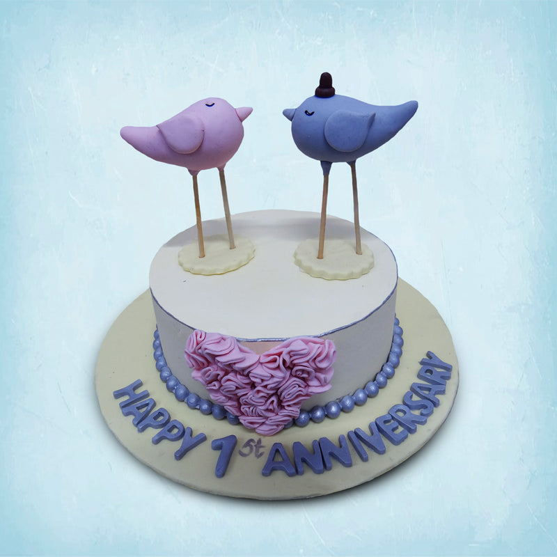 Love birds anniversary cake for a couple who are newly married and are celebrating the first year of togetherness
