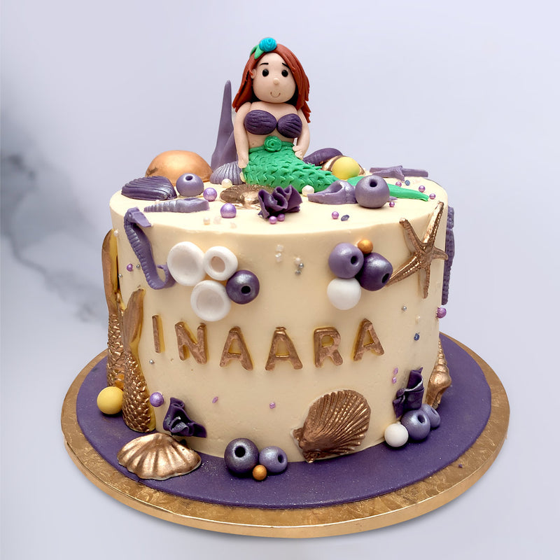 This mermaid cake is unique in its own sense a beautiful mermaid (aerial) sitting on top of the cake with sea corals and lot of fishes