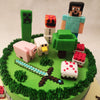 The earthy green colour of this gamer birthday cake for kids' base along with the buttercream pipings of grass represent the lay of the minecraft land. 