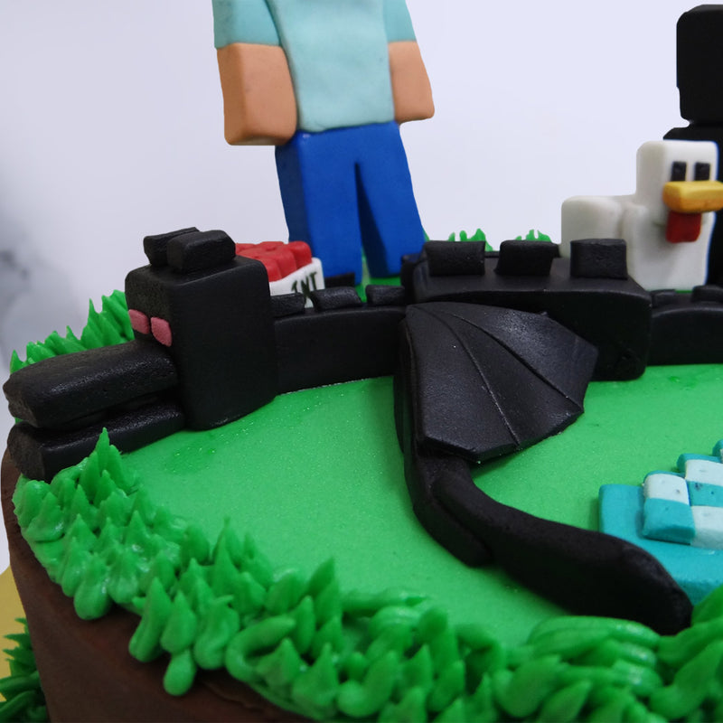 This Minecraft cake design features a 3D, edible model of Steve, the main protagonist, the infamous chicken and an enderman figure and the ender dragon