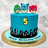 This kids birthday cake or PJ mask cake is set in Tarabiscoville, the fictional French city of the show. The beautiful city buildings are all laid against the dark blue night sky, making this cartoon cake a way to walk down the streets of France.
