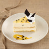 Slice view of passion fruit cheesecake shows the creamy sponge and flavours inside the no bake cheesecake. This is the best passionfruit cheesecake in bangalore  