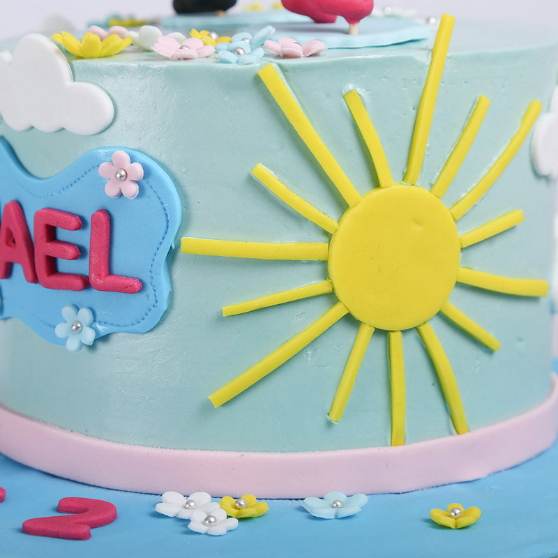 This peppa pig cake has as unique designer cake features which is highlighting a sun as bright day symbol on Peppa pig theme cake  