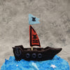 The pirate ship on this pirate theme cake is carved out in a way that resembles both chocolate and an actual wooden ship sailing through this kids birthday cake . The pirate flag hoisted upright on this cartoon cake is in a dangerous shade of red with a skill and the birthday boy's or birthday girl's name on it And even an anchor has been added onto the design 