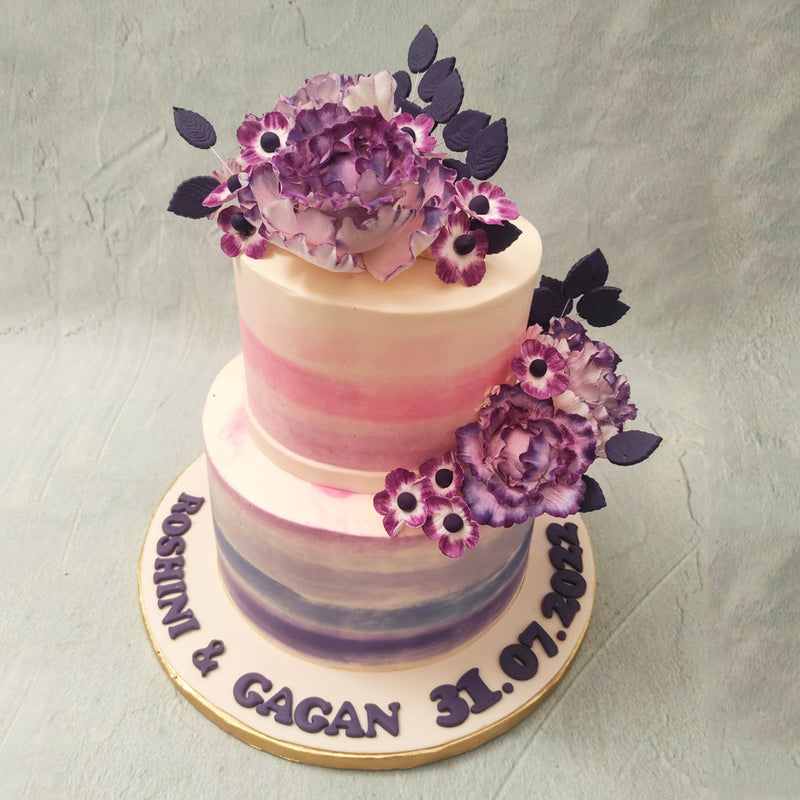 This purple floral cake isn't just a vision of bluebells but of wedding bells too! A Purple 2 tier cake  is just what you need to add some more elegance and artistic realism to one of the most special days of your life!