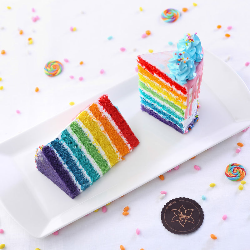 Rainbow birthday cake cut view 7 layers of color sponge 