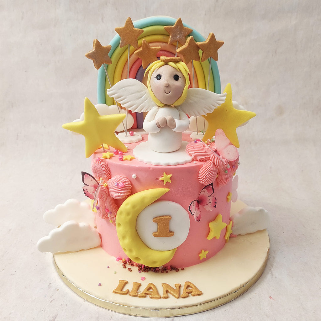 Featuring a flamboyant and colourful design, this angel theme cake comes with a creamy, bright pink base loaded with heavenly and celestial icons.