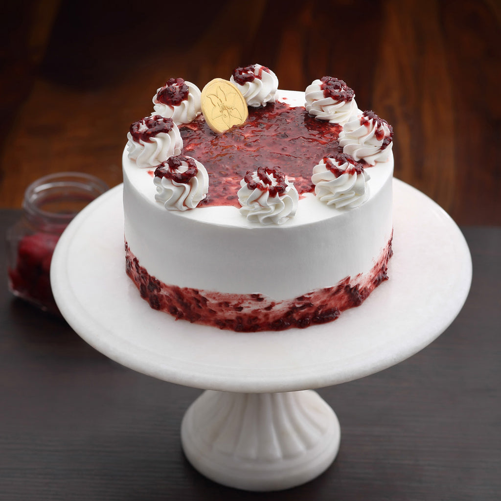 Raspberry Vanilla Cake is a tasty combination of Raspberry compote and vanilla sponge cake. This cake is delicious and looks pretty on the ourside as well. Order online this Raspberry cake for same day delivery across bangalore 