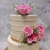 Some anniversary cakes are made with flour, others are made with flowers. The pink and white tones of this cake with flowers set an elegant appearance for your event and the placement of the roses is done in such a way that it gives this floral wedding cake for her/him a minimalist and simplistic theme.