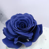 Zoomed view of Anniversary blue rose cake which is highlighting all the petals of this beautiful rose flower. This blue edible rose sits really beautifully on top of our fault line cake