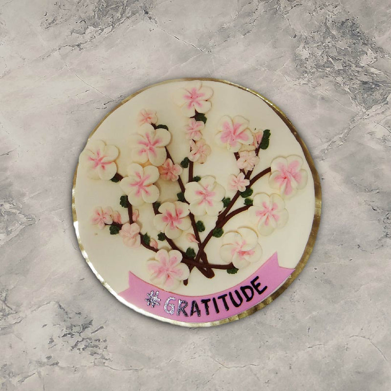 Top view of sakura cake or cherry blossom theme cake where you can see cherry blossom blooming on top of the cake
