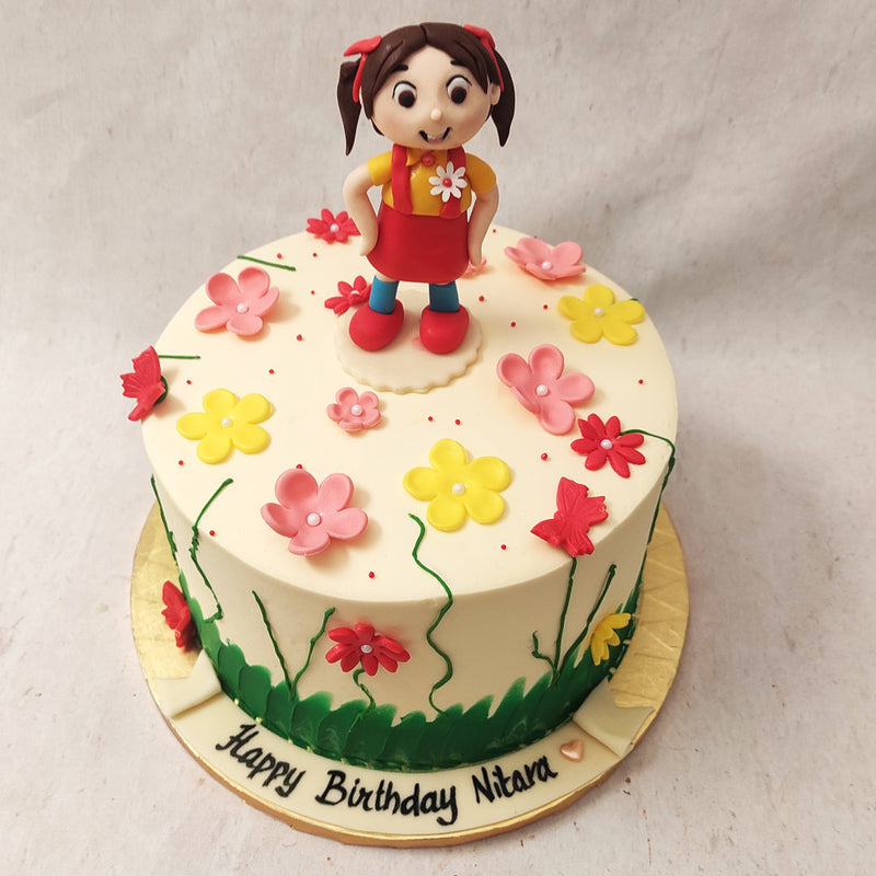 The girly yet bold colour palette of this colourful girl in garden cake makes it unique and eye-catching, while not distracting from the attention of the beautiful, birthday girl.