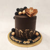 Basically a floral chocolate cake, this design comes with a simple yet tall chocolate base, embellished with black and gold baubles and a gold spray at the base, adding to the artistic aesthetic. 