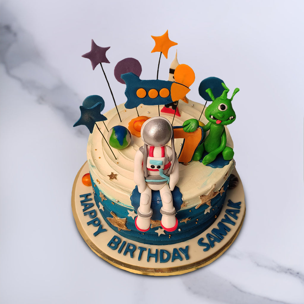 This space theme cake for kids birthday is a best option as this cake contains all the imaginations that a kid holds about the space from astronauts to rockets to aliens and lot of stars and planets.