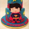 An edible, cartoonish version of a kid Superman striking a pose is placed in the center of this superhero theme cake and bears a friendly, welcoming smile to greet the birthday boy/girl. 