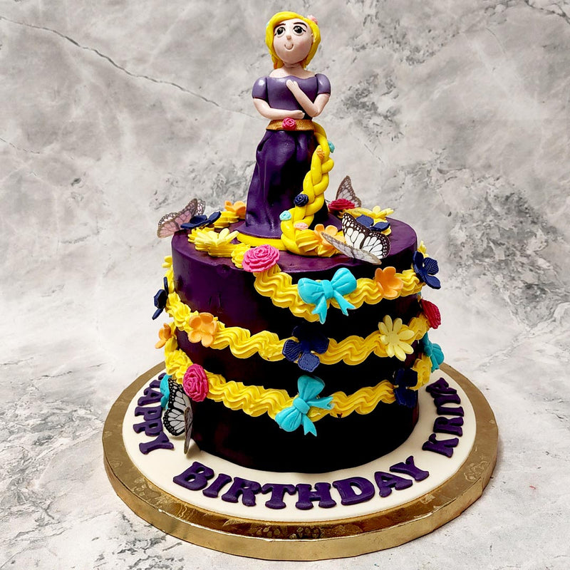 This tangled birthday cake for kids was moulded after a figurine of the famous Disney Princess Rapunzel from the well-known and well-loved movie Tangled. The magic of the aesthetic captured in this Tangled Rapunzel cake comes from the use of vibrant colours and fairytale-like elements taken straight from the film