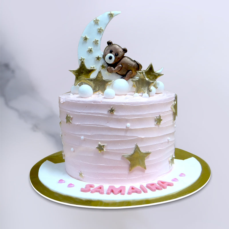 Teddy bear sleeping on the moon cake shows a cute teddy bear hugging the moon and sleeping over it while getting surrounded by glowing stars. This hug the moon cake is surely the best birthday cake for her to cherish the moment