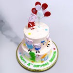 Top view of 2 tier peppa pig cake design to showcase the balloons and all the other elements present on this peppa pig cake