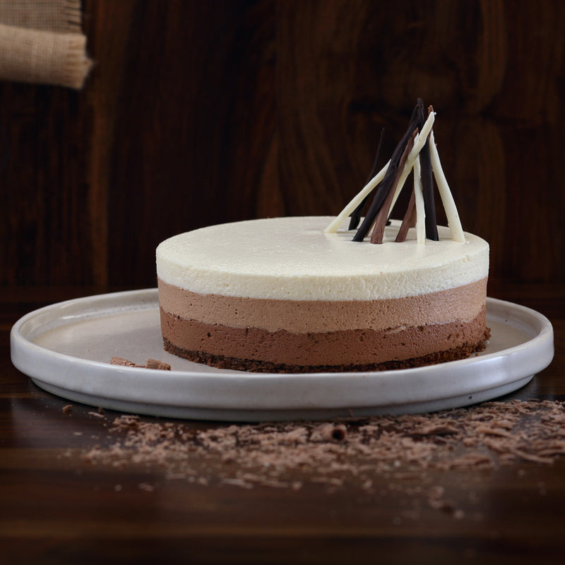 Triple chocolate mousse cake with chocolate sticks on top of the cake makes it look classy and elegant. This no baked triple chocolate mousse cake is the style icon of Liliyum.