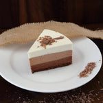 Triple chocolate mousse cake slice view to show you the inner layers of this mousse cake which is actually a no baked mousse cake thats tastes just brilliant 