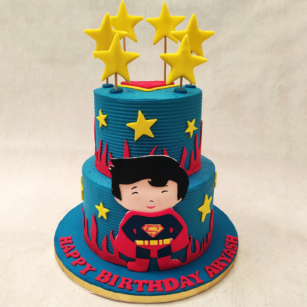 Both tiers of this Superman kid cake with stars come in a matted and vibrant shade of blue with red flames at the bottom to capture the red and blue colour palette of Superman's costume. 