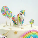 My little pony cake with a rainbow unicorn theme has a liitle pony on top of the cake as a topper.