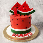 The glossy coating on this watermelon cake design adds to the look of it being like the succulent fruit perfect for a hot summer day. Two triangular slices of watermelon are placed on top of this kids birthday cake with adorable, smiling faces painted on them making it apt for a first birthday cake