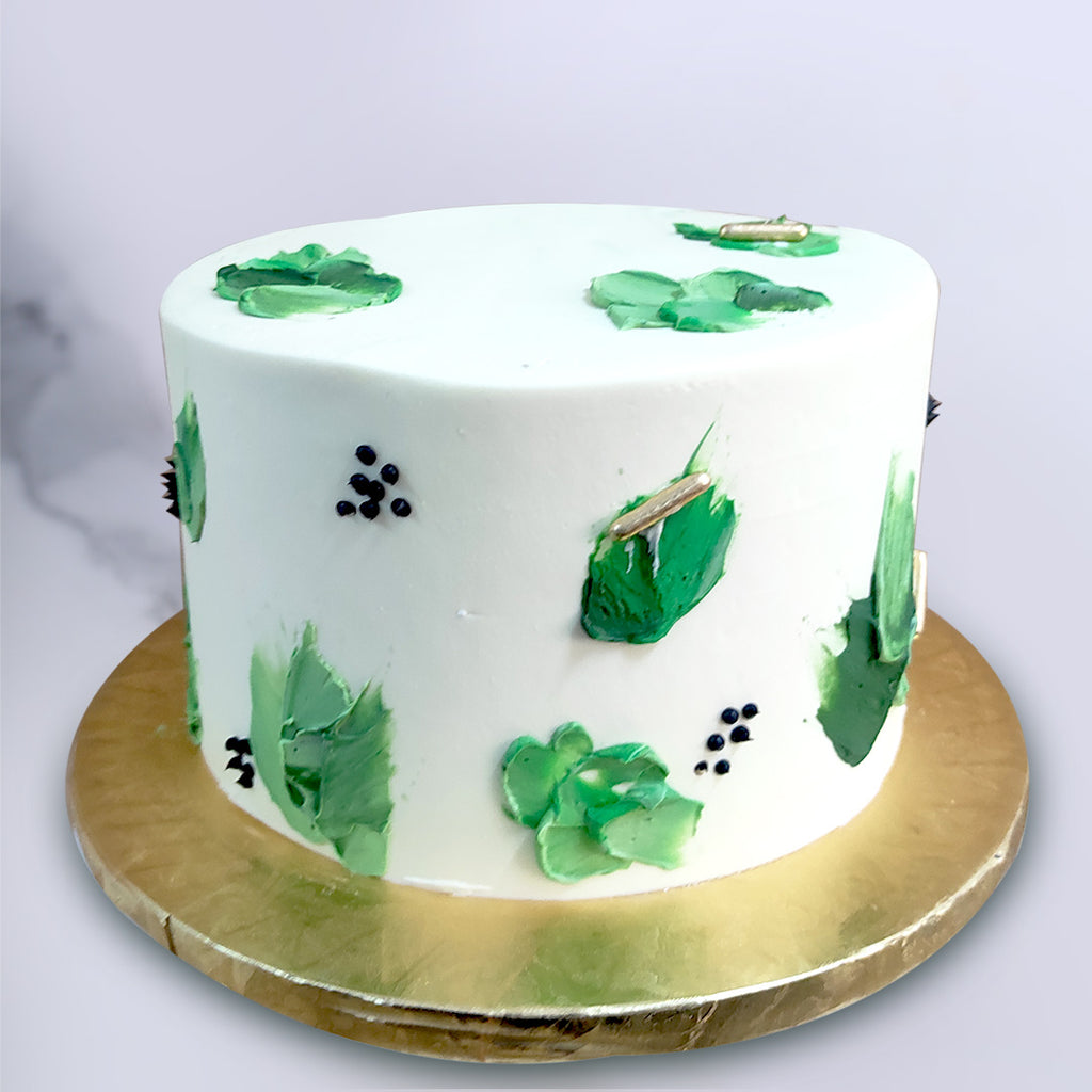 We present to you one of our most unique designs: the green abstract cake. A fun crossover between abstract art and artisanal aliment, this abstract buttercream cake will be a statement piece and conversation starter all in one. 