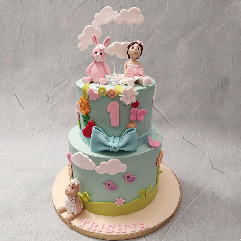  This baby girl 1st birthday cake is baked with imagination and piped with the dreams of the little ones who are as filled with wonder and awe at the colours and shapes of the big, wide world around them.