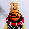 This basketball net cake design was originally designed for a true fan of all three: the player, the team and the game. So to pay homage to him and on this cake for him, we have a  jersey number displayed proudly on top. 