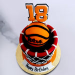 This basketball theme cake design comprises a lustrous black and red basketball hoop in colours that just pop. On top is an edible basketball displaying the name of the birthday boy or girl making this design more personal as a basketball cake for him.
