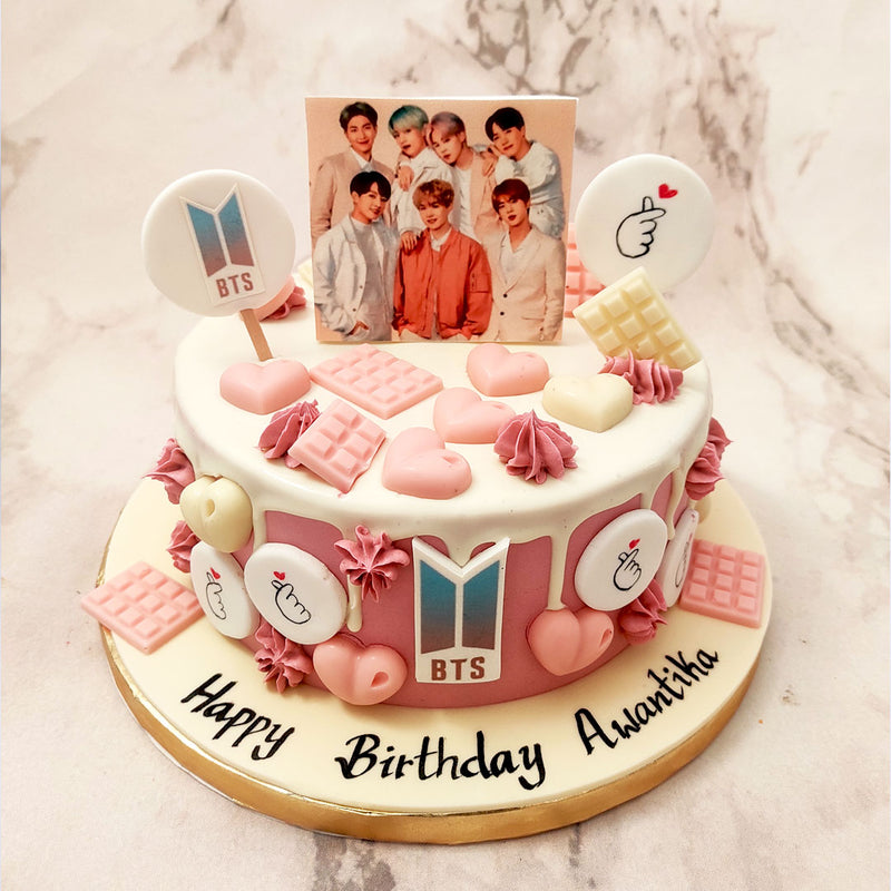 This BTS birthday cake paints a picture of something taken straight out of Pinterest. It's pink, it's popular, it's pretty. It's a BTS themed birthday cake for her / him to add something even more special to your already special day