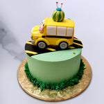 With the Cocomelon watermelon balanced on top of the yellow school bus from The Wheels On The Bus episode of the show and the yellow and black road underneath, this Cocomelon bus cake is full of fun surprises to gawk at and gobble up.