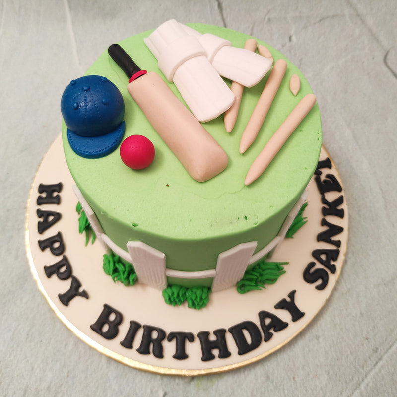 We’ve attempted to knock it out of the park with this bat and ball cake design that acts as a scrumptious showcase of cricket kit mementos in the form of a cake for a cricket fan.