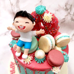 If your child has a sweet-tooth, this design would make the perfect donut birthday cake for him / her . Combining life-sized versions of macarons and a doughnut onto a miniature version of what the 'Land of Treats' would look like was a way to add some dynamic and playful fun to this donut theme cake.