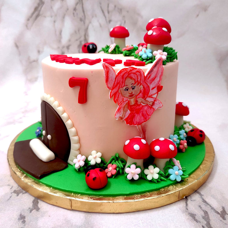 According to popular legend and folklore, fairies are said to live in woodland communities like in a mushroom in a garden or in tiny little stone or grass houses, surrounded by the magic of nature which we have tried to capture in this mushroom theme cake design.This fairy mushroom cake has a light pink base, which looks like the walls of the house. 