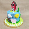 This farm themed birthday cake for kids also features a traditional, wooden-doored, red-walled barn standing tall and proud on top of this farm animal cake design with some colourful flowers around it, like something straight out of an aesthetic illustration.