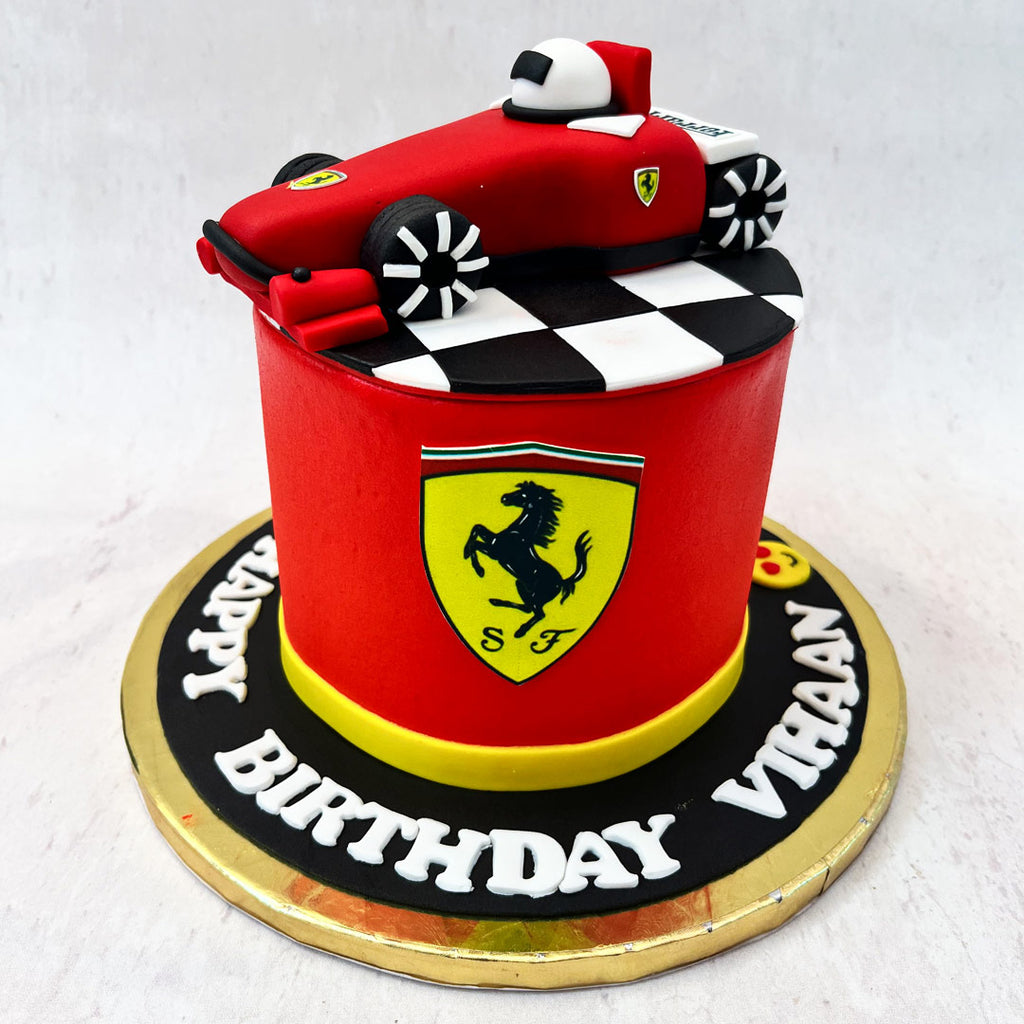 This Ferrari F1 theme cake is for a fun-filled and flavour-fuelled celebration of another successful year. This Ferrari birthday cake is a tribute to the birthday girl/boy and that which is permanently parked in a special place in their hearts: Formula One!