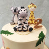 At the top of this forest animal theme cake, is a Koala symbolising community, stability and family, while the giraffe next to it symbolises a deeper connection with nature while looking to the future. Finally, the zebra symbolises community, freedom and balance.