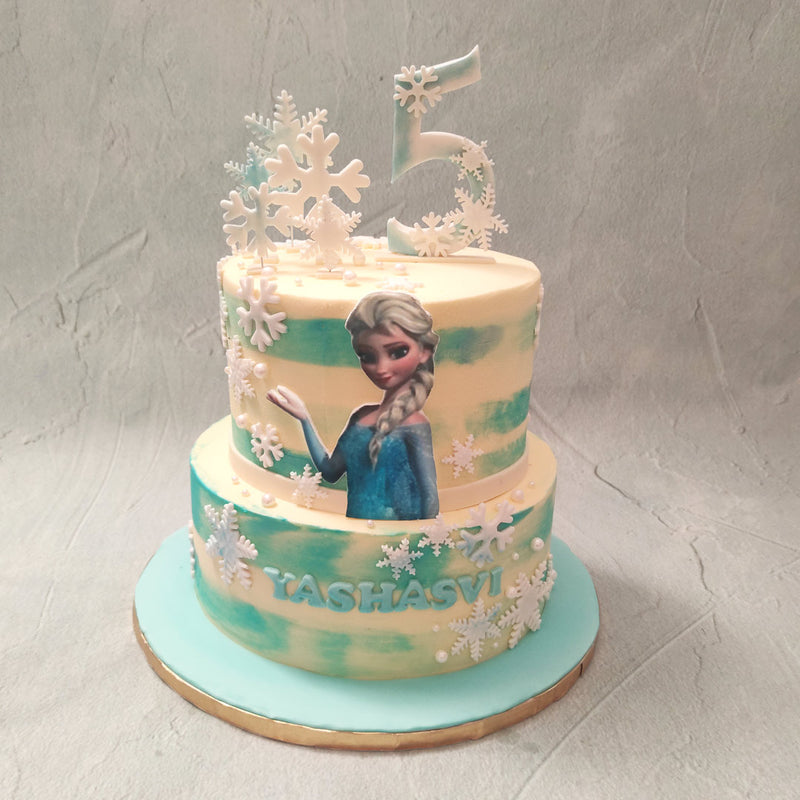 If you're feeling a little blue, this two tier frozen cake is a great reminder why that might not be such a bad thing. Taking inspiration from the beloved Disney film, this Frozen cake 2 tier design is a little bit of edible magic from us to you.