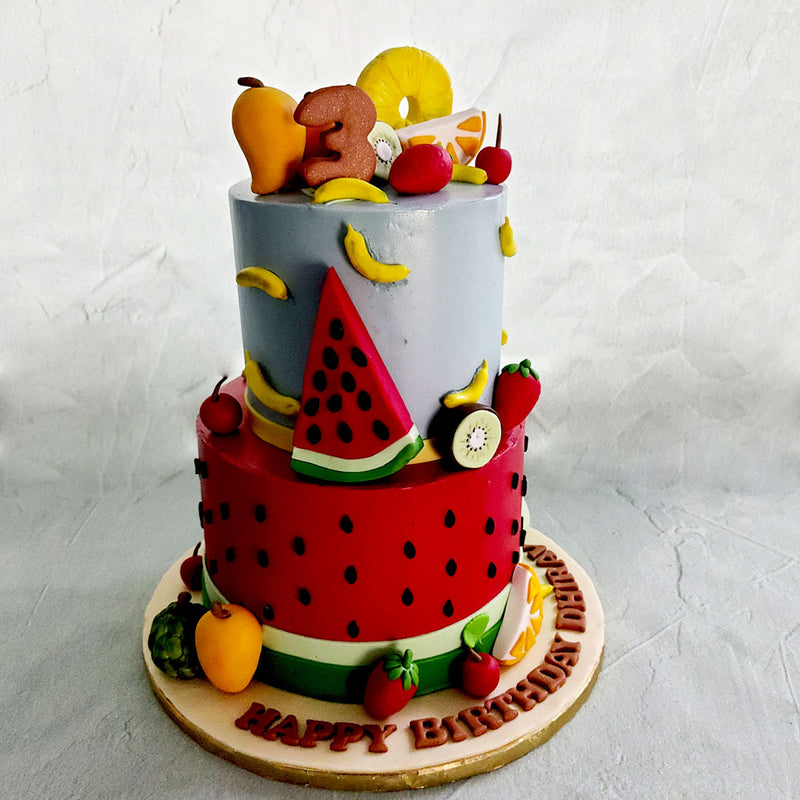 We were brainstorming new cake design ideas and this fruit theme birthday cake for kids was the fruit of our labour.  Something to go bananas over or to be the apple of your eye, either way this fruit theme cake and you are sure to be grape pear! 