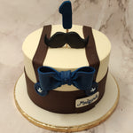 From the buttons, to the stitching on them, from the name tag near the shirt pocket and the blue accent of the life-sized edible bow tie against the yellow and brown background, we believe that the effort we've taken to pay attention to the details is what sets this gentleman cake design apart.
