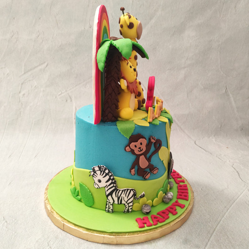 A tiny elephant, monkey and zebra can be found on the lovely blue base of this jungle animals cake and with the big, bright and beautiful sunflowers embedded into it, even more of a tropical theme is brought to life.
