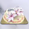 This cake with lily flowers comes in a neutral shade of yellow with an edible circular disk on top that is there to display your personalised message. Next to this disk, trickling down the side of the lily flower birthday cake for girls are three beautiful, pink lilies that look completely realistic but are entirely edible. 