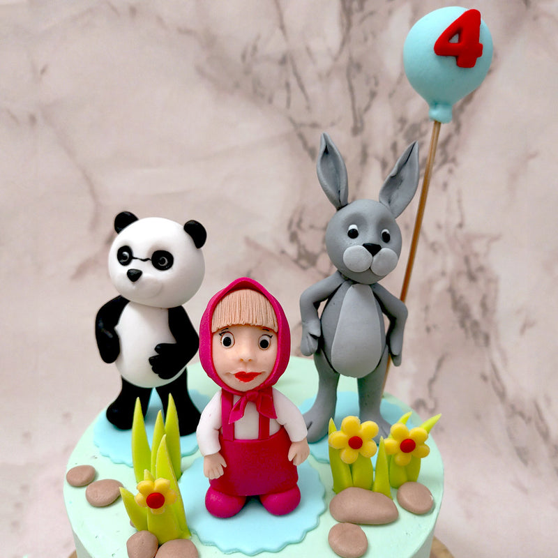 More figurines can be seen adorning the top of this Masha and the bear birthday cake for kids such as main character Masha herself, Mishka's cousin Panda and Hare who is holding up a helium balloon display of the birthday boy's/girl's age.