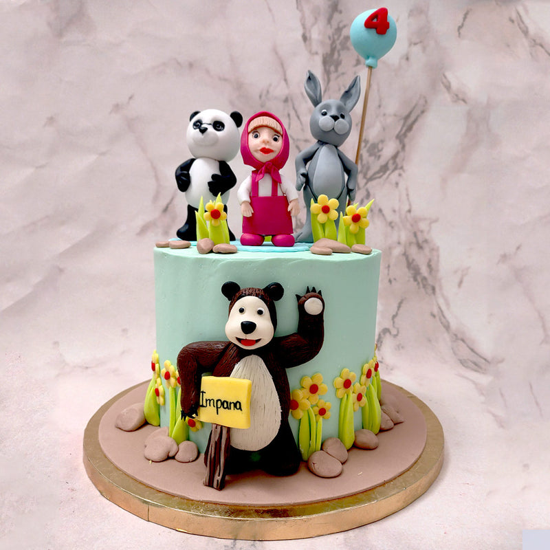 The sky-blue bottom tear of this Masha cake features a realistic recreation of Mishka the bear stuck to the side holding a sign. Colourful sunflowers and pebbles adorn the base's border and add the same kind of naturesque vibe that the show has to the Masha and the bear cake design.